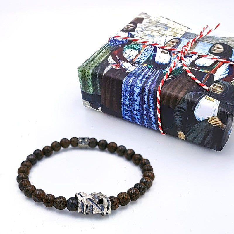Bracciale elastico con pietra Granato e maschera sarda mamuthones in argento