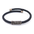 Bracciale sardo in pelle nera intrecciata con passante in filigrana d'argento